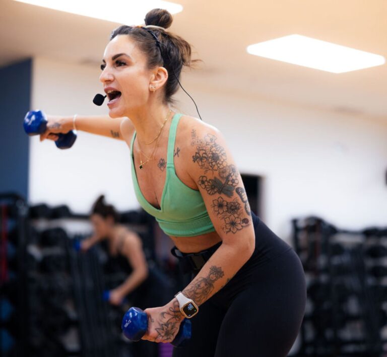the-workout-club-londonderry-nh-location-near-me-fitness-membership-tattooed-pilates-instructor-women-weight-training-class-toned-dumbells-fit-lean-pilates