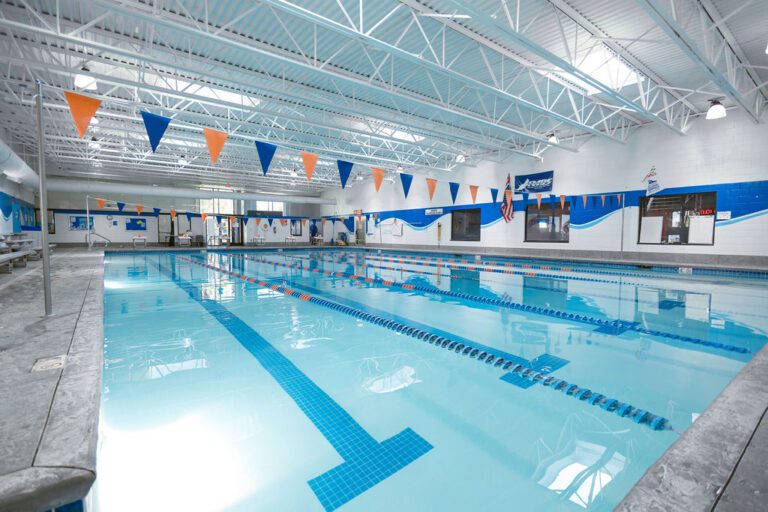 Indoor swimming pool at The Workout Club Londonderry with lap lanes and bright natural lighting.