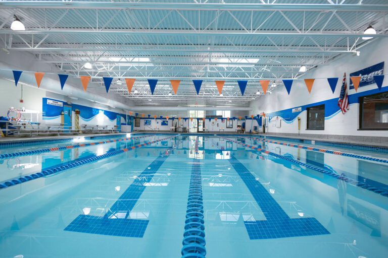 Spacious indoor lap pool at The Workout Club Londonderry used for swim team training and fitness swimming.
