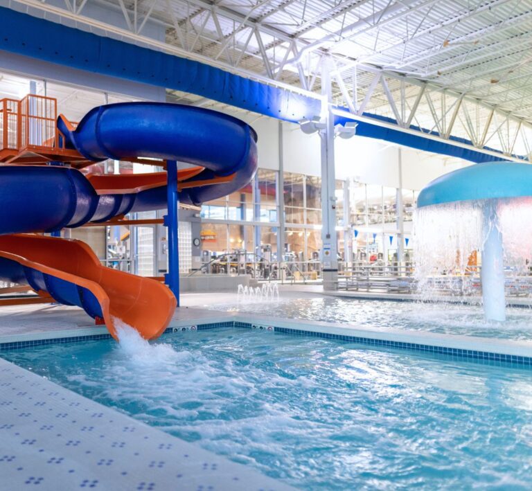 the-workout-club-salem-nh-location-near-me-fitness-membership-swim-lap-pool-aqautics-class-warm-water-slide-play-splash-zone-blue-orange
