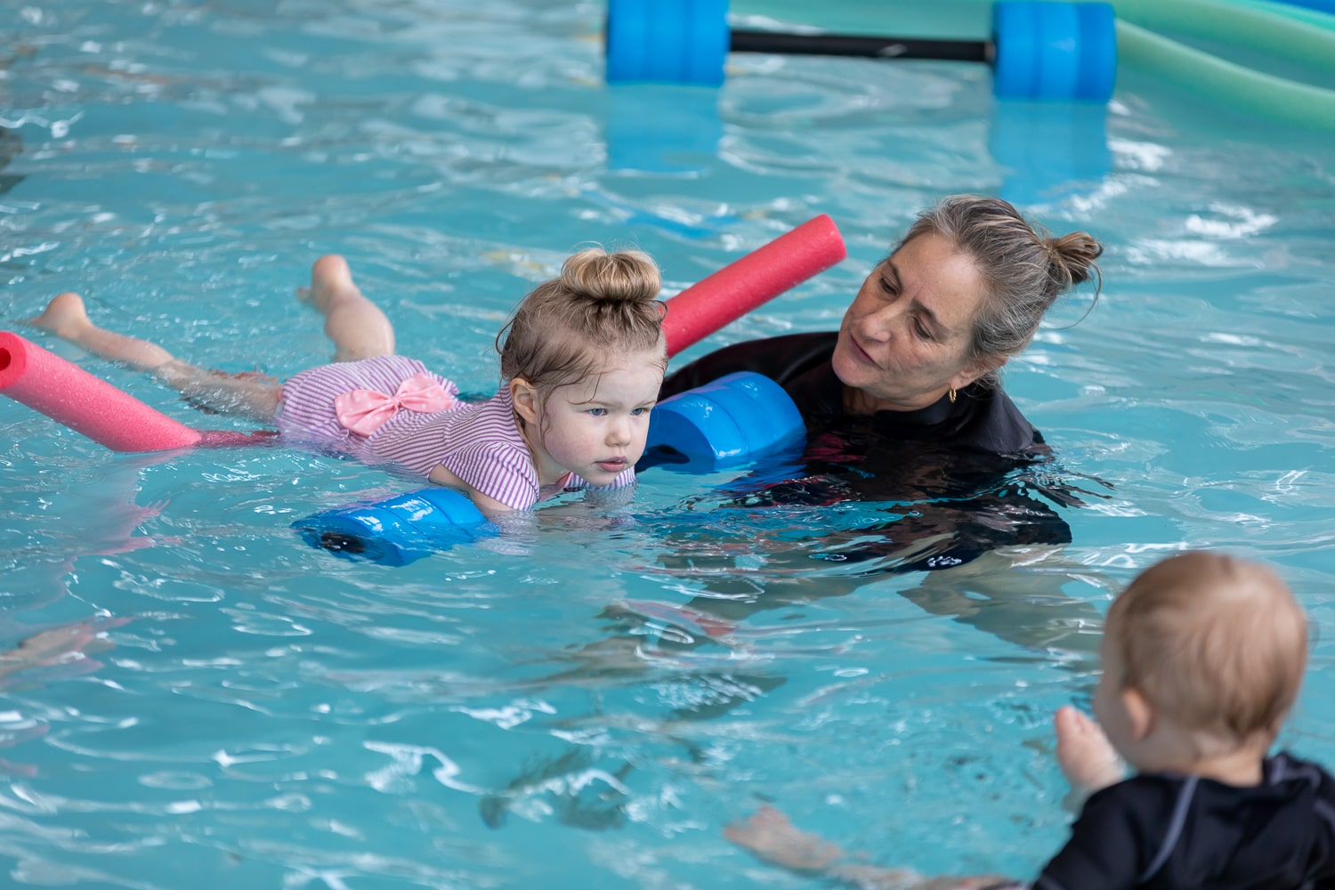 Child being given a swimming lesson at Londonderry gym. 